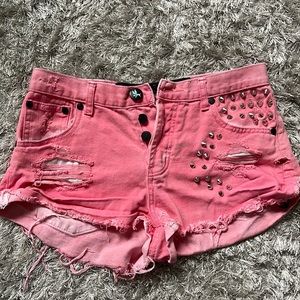 Pink studded jean shorts